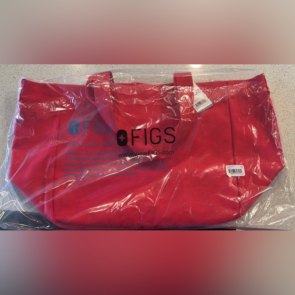 Figs Canvas Tote in Pop Red with magnetic snap closure.